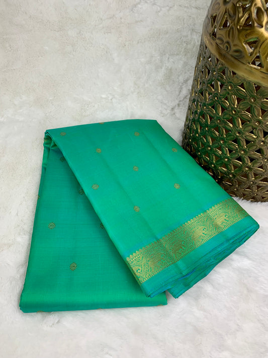 Green Kanchipuram pure zari silk saree.